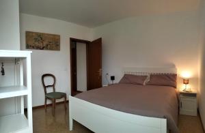 Postel nebo postele na pokoji v ubytování Agriturismo Le Crede 1930