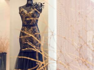 a dress on a mannequin in a window at Mercure Paris Place d'Italie in Paris