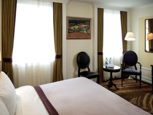 Postel nebo postele na pokoji v ubytování Hotel Rotary Geneva - MGallery
