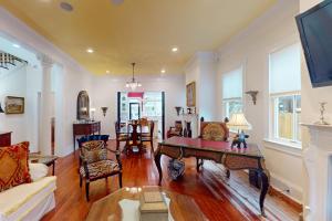 a living room with a table and chairs at Anderson Place in Savannah