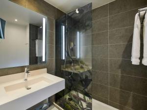 Koupelna v ubytování Mercure Paris La Défense