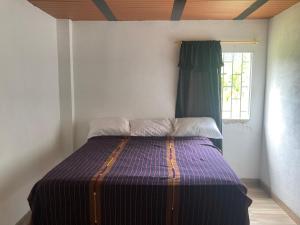 Postel nebo postele na pokoji v ubytování Maracuya Hostel
