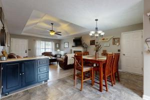 a kitchen and living room with a table and chairs at Mount Juliet Charmer in Hunters Store