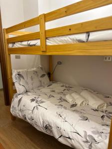 a bedroom with two bunk beds in a room at Al Garofano Rosso in Cison di Valmarino +20 photos