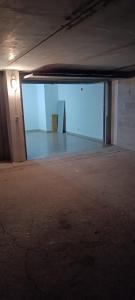 an empty parking garage with a large empty room at Al Garofano Rosso in Cison di Valmarino