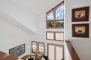 a staircase in a house with a window at Woodrun Place 56 in Snowmass