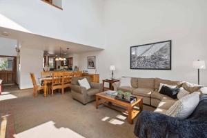 a living room with a couch and a table at Woodrun Place 56 in Snowmass