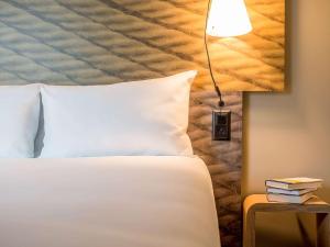 Cama ou camas em um quarto em ibis Genève Aéroport