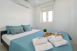 Ένα ή περισσότερα κρεβάτια σε δωμάτιο στο Host Wise - Charming House with Ocean View