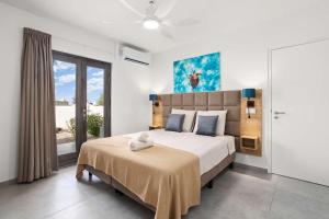 Ένα ή περισσότερα κρεβάτια σε δωμάτιο στο Bonaire Beach Apartment 2 with communal pool and diving facilities
