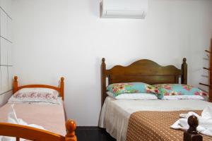 Cama ou camas em um quarto em Pousada Canto da Sereia