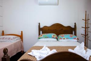 Cama ou camas em um quarto em Pousada Canto da Sereia
