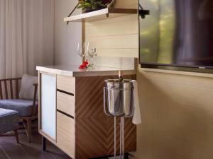 a room with two wine glasses and a counter at Sofitel Fiji Resort & Spa in Denarau