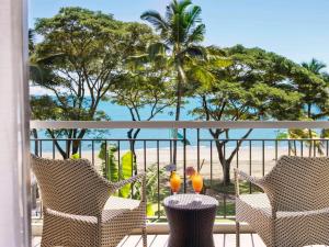 two birds sitting on a table on a balcony at Sofitel Fiji Resort & Spa in Denarau