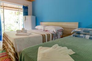 Cama ou camas em um quarto em Pousada Canto da Sereia