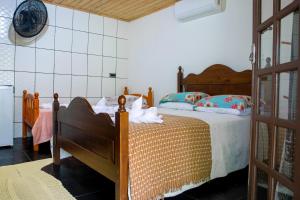 Cama ou camas em um quarto em Pousada Canto da Sereia