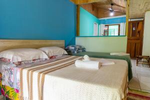 Cama ou camas em um quarto em Pousada Canto da Sereia