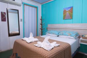 Cama ou camas em um quarto em Pousada Canto da Sereia