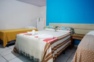 Cama ou camas em um quarto em Pousada Canto da Sereia