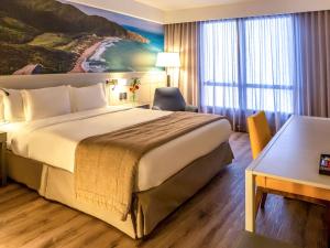 Postel nebo postele na pokoji v ubytování Novotel Florianopolis
