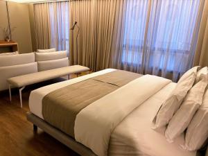 Postel nebo postele na pokoji v ubytování Novotel Florianopolis