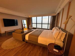Postel nebo postele na pokoji v ubytování Novotel Florianopolis