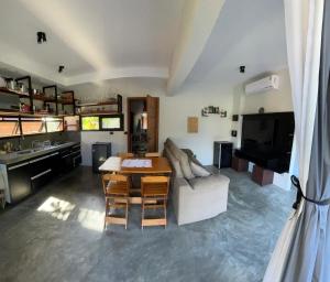 a living room with a couch and a table at Barong EcoVilla in Barra Grande