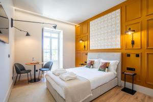 Postel nebo postele na pokoji v ubytování Gigantones GuestHouse
