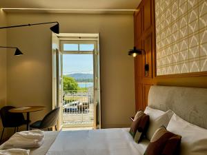 Postel nebo postele na pokoji v ubytování Gigantones GuestHouse