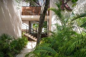 a staircase in a building with green plants at New Loft! Jungle Gym Best Pool in Tulum