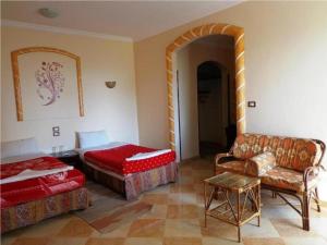 Postel nebo postele na pokoji v ubytování Nile Valley Hotel