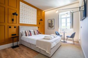 Postel nebo postele na pokoji v ubytování Gigantones GuestHouse