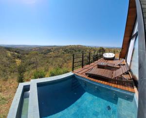 a view of a house with a swimming pool at Eros lodge in Jaboticatubas
