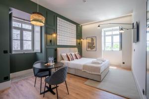 Postel nebo postele na pokoji v ubytování Gigantones GuestHouse