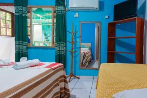 Cama ou camas em um quarto em Pousada Canto da Sereia