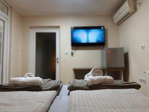 Postel nebo postele na pokoji v ubytování Royal Apartmani