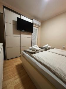 Postel nebo postele na pokoji v ubytování Royal Apartmani