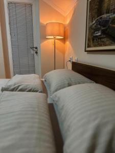 Postel nebo postele na pokoji v ubytování Royal Apartmani