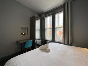 Katil atau katil-katil dalam bilik di Bentinck Apartments