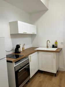 Η κουζίνα ή μικρή κουζίνα στο Appartement Chill & confort +5 φωτογραφίες