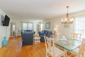 a dining room and living room with a table and chairs at Stunning 3 Bedroom Condo-Recently Renovated-Fairways Unit D in Myrtle Beach