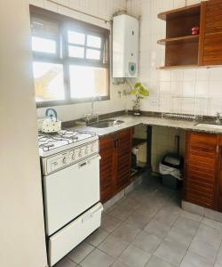 Kuchyň nebo kuchyňský kout v ubytování Hermoso departamento a una cuadra casa historica + 8 fotografií