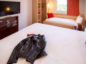 Postel nebo postele na pokoji v ubytování Ibis Hotel Plzeň