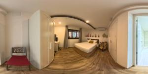a bedroom with a bed and a desk in a room at Camins del Priorat Ermita sant Pau in Masroig