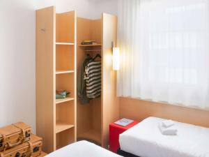 Postel nebo postele na pokoji v ubytování Ibis Lugano Paradiso