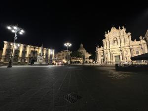 a large building at night with lights on at Elephant and Castle - Exclusive Holiday Home in Catania