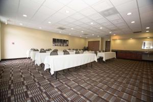 a conference room with white tables and chairs at Best Western Port Columbus in Columbus