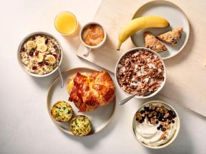 a table with plates of food and bowls of breakfast foods at Residence Inn by Marriott Houston NASA/Clear Lake in Friendswood