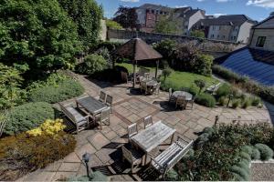 a patio with a gazebo and tables and chairs at Best Western Plus Angel Hotel in Chippenham