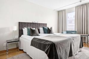 Postel nebo postele na pokoji v ubytování Best Western Plus Grand Hotel Elektra